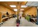 Large garage space with wooden walls, multiple work stations, and lighting at 5839 Darry Cir, Norcross, GA 30093