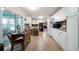Bright kitchen with white cabinets, modern appliances, and a breakfast nook at 5839 Darry Cir, Norcross, GA 30093