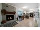 Open kitchen featuring modern appliances, a breakfast nook, and a cozy fireplace at 5839 Darry Cir, Norcross, GA 30093