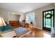 Cozy living room with hardwood floors, large windows, and comfortable furnishings at 5839 Darry Cir, Norcross, GA 30093