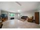 Open living room boasts recessed lighting and large window, perfect for entertaining at 5839 Darry Cir, Norcross, GA 30093