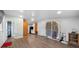 Bright living room with wood-look floors, neutral walls, and storage at 5839 Darry Cir, Norcross, GA 30093