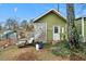 A small shed with a white door and a lattice privacy screen at 5839 Darry Cir, Norcross, GA 30093