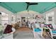 Inviting sunroom filled with natural light and adorned with unique decor and comfortable seating at 5839 Darry Cir, Norcross, GA 30093