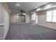 Expansive basement featuring neutral carpet, recessed lighting, and access to the outside at 610 Big Bend Trl, Sugar Hill, GA 30518