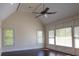 Bright bedroom boasting hardwood floors, large windows, and vaulted ceiling with a ceiling fan at 610 Big Bend Trl, Sugar Hill, GA 30518