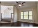 Bedroom with coffered ceiling, hardwood flooring, a ceiling fan, and a large window at 610 Big Bend Trl, Sugar Hill, GA 30518