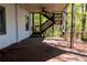 Wooden deck showcasing stairs to upper level and surrounding lush trees at 610 Big Bend Trl, Sugar Hill, GA 30518