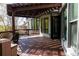 Inviting deck featuring a pergola with string lights and decorative wood railing at 610 Big Bend Trl, Sugar Hill, GA 30518