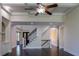 Elegant foyer featuring a staircase with wrought iron railings and dark hardwood floors at 610 Big Bend Trl, Sugar Hill, GA 30518