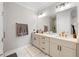Modern bathroom featuring double sinks, sleek fixtures, and a spacious glass-enclosed shower at 6135 Redwine St, Norcross, GA 30071