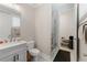Bathroom featuring white marble floors, a glass shower, and a vanity with a sink at 6135 Redwine St, Norcross, GA 30071