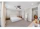 Minimalist bedroom with a simple bed frame, neutral color scheme, and ample natural light at 6135 Redwine St, Norcross, GA 30071