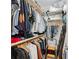 Organized walk-in closet with ample hanging space, shelves, and a convenient ladder for easy access at 6135 Redwine St, Norcross, GA 30071