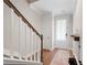 Entryway with wooden floors, white trim, staircase, and natural light at 6135 Redwine St, Norcross, GA 30071