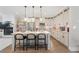 Spacious kitchen featuring white cabinets, stainless steel appliances, and a large center island at 6135 Redwine St, Norcross, GA 30071