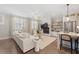 Inviting living room featuring a fireplace, built-in shelving, and an open-concept design at 6135 Redwine St, Norcross, GA 30071