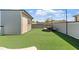 Rooftop deck with artificial turf, string lights, and outdoor furniture at 6135 Redwine St, Norcross, GA 30071
