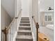 Carpeted staircase with wooden handrail at 6135 Redwine St, Norcross, GA 30071