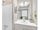 Bathroom features vanity, sink, mirror, shower, and toilet at 992 Old Holcomb Bridge Rd, Roswell, GA 30076