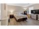 Bedroom featuring a bed, dresser, bedside tables, and a window at 992 Old Holcomb Bridge Rd, Roswell, GA 30076