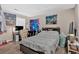 Cozy bedroom with neutral walls and wood-look flooring offers a relaxing retreat at 992 Old Holcomb Bridge Rd, Roswell, GA 30076