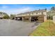 Exterior view of a multi-Gathering house, featuring convenient carport parking for residents at 992 Old Holcomb Bridge Rd, Roswell, GA 30076