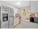Compact kitchen featuring stainless steel refrigerator and ample storage space at 992 Old Holcomb Bridge Rd, Roswell, GA 30076