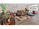 Open-concept living space with comfortable sofas and sleek vinyl floors at 992 Old Holcomb Bridge Rd, Roswell, GA 30076