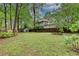 Spacious backyard with garden, shed, wooden deck and mature trees, ideal for outdoor activities at 1587 Wainwright Se Dr, Atlanta, GA 30316