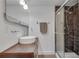 Bathroom boasts a vessel sink, glass enclosed shower with custom tile and hardwood floor at 1587 Wainwright Se Dr, Atlanta, GA 30316