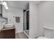 Bathroom features vessel sink, glass enclosed shower with custom tile and hardwood floor at 1587 Wainwright Se Dr, Atlanta, GA 30316
