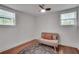 Cozy bedroom with hardwood floors, neutral color scheme, and a round area rug at 1587 Wainwright Se Dr, Atlanta, GA 30316