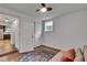 Neutral bedroom with hardwood floors, storage and window with backyard view at 1587 Wainwright Se Dr, Atlanta, GA 30316