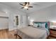 Bright bedroom features hardwood floors, ceiling fan, ensuite bath, and ample closet space at 1587 Wainwright Se Dr, Atlanta, GA 30316