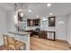 Well-lit kitchen featuring stainless appliances, granite countertops, and an inviting breakfast bar at 1587 Wainwright Se Dr, Atlanta, GA 30316