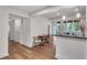Open-concept living space featuring hardwood floors, neutral color palette, and plentiful natural light at 1587 Wainwright Se Dr, Atlanta, GA 30316