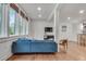 Cozy living area with hardwood floors and natural light, featuring a comfortable blue sectional sofa at 1587 Wainwright Se Dr, Atlanta, GA 30316