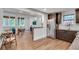 Open floor plan showcasing kitchen, breakfast nook and living area with hardwood floors and neutral decor at 1587 Wainwright Se Dr, Atlanta, GA 30316