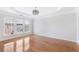 Bright bedroom features hardwood floors, large windows, and recessed lighting with modern ceiling fan and tray ceiling at 2775 Loftview Sq # 8, Atlanta, GA 30339
