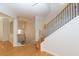 Elegant staircase featuring hardwood floors, decorative iron railing, and a naturally lit landing area with neutral paint at 2775 Loftview Sq # 8, Atlanta, GA 30339
