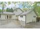 Charming home's backyard, featuring a spacious deck and outdoor access through elegant double doors at 2988 Chipmunk Se Trl, Marietta, GA 30067