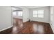 Bedroom with wood-look flooring, ample natural light from the large window, and neutral paint at 2988 Chipmunk Se Trl, Marietta, GA 30067