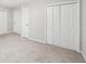 Spacious bedroom with neutral carpet and bi-fold closet doors at 2988 Chipmunk Se Trl, Marietta, GA 30067