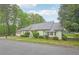 Angled side view of single-story home with a well maintained lawn and curb appeal at 2988 Chipmunk Se Trl, Marietta, GA 30067