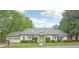 Charming single-story home featuring a well-maintained lawn, a two-car garage, and a welcoming front entrance at 2988 Chipmunk Se Trl, Marietta, GA 30067
