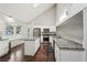 Bright kitchen featuring granite countertops, stainless appliances, and hardwood flooring, with lofted ceilings at 2988 Chipmunk Se Trl, Marietta, GA 30067