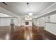 Open living room with hardwood floors, fireplace, and access to other areas of the home at 2988 Chipmunk Se Trl, Marietta, GA 30067