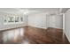 Open living room featuring hardwood floors, large windows, and neutral colors at 2988 Chipmunk Se Trl, Marietta, GA 30067
