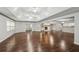 Open living room boasts hardwood floors, tray ceilings, and a fireplace with a built-in bar area at 2988 Chipmunk Se Trl, Marietta, GA 30067
